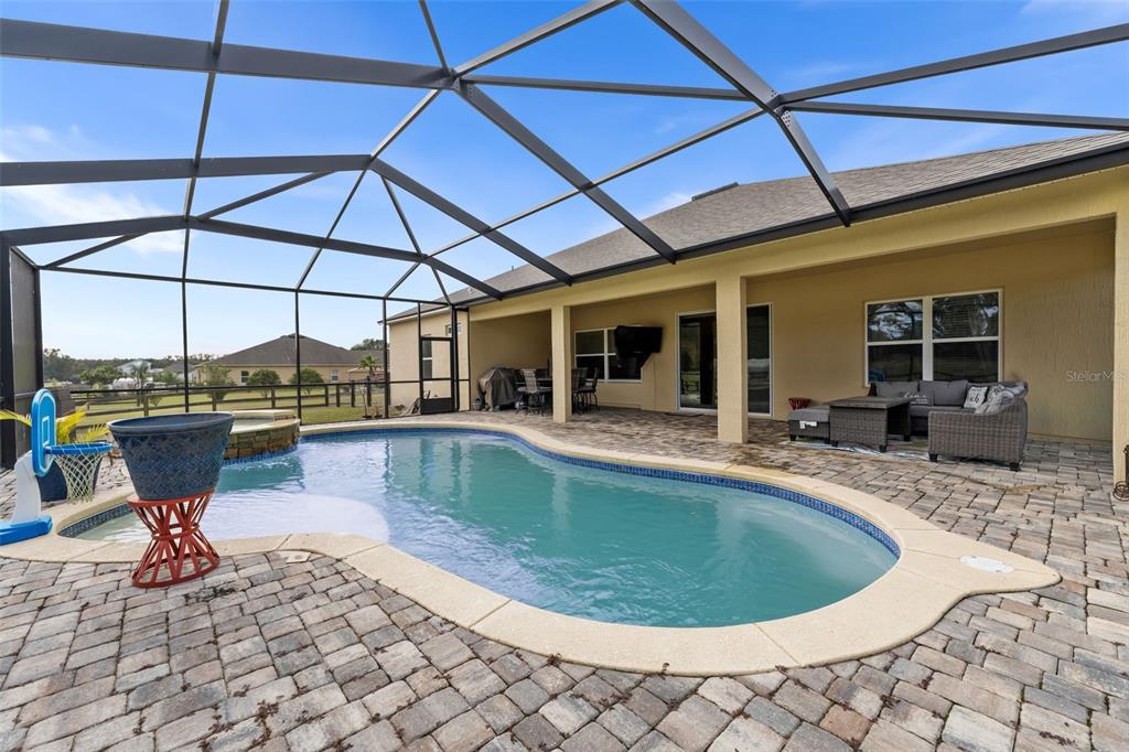 5615 Southwest 215th Terrace Newberry, FL 32669 - Photo 34 of 45 a view of a swimming pool with a patio