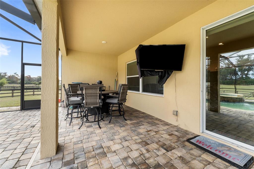 5615 Southwest 215th Terrace Newberry, FL 32669 - Photo 35 of 45 a view of a dining room with furniture and wooden floor