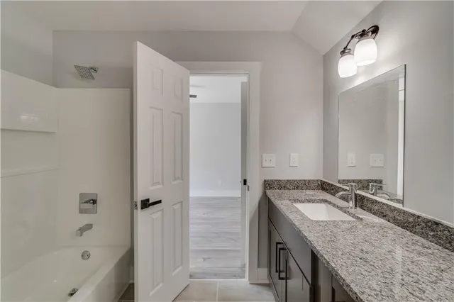 a white toilet sitting next to a white wall