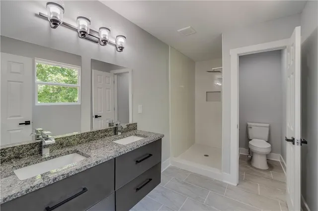 a bathroom with a glass shower door