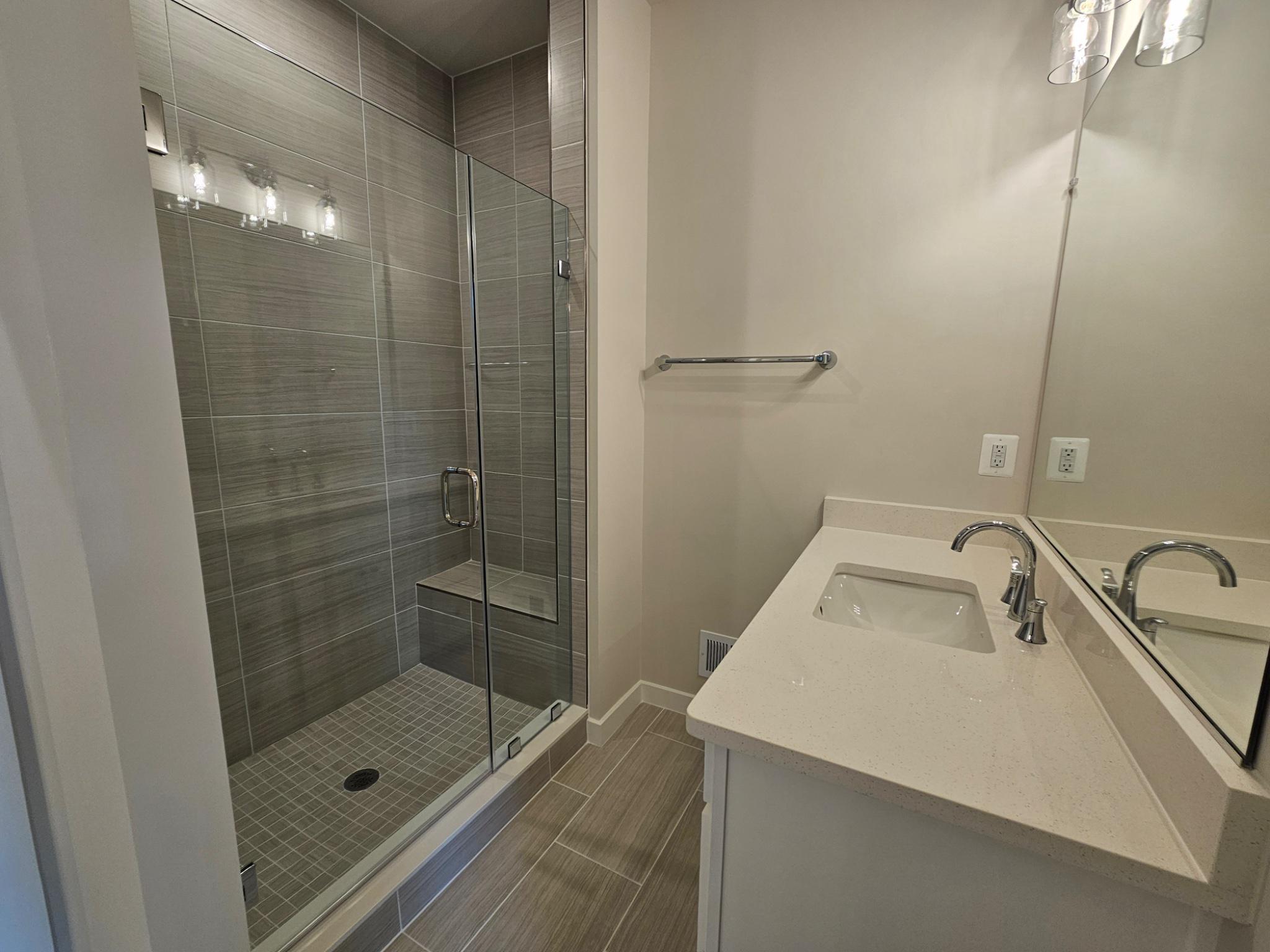 13721 Cobble Loop Woodbridge, VA 22193 - Photo 16 of 27 Primary bathroom w/ frameless glass shower.