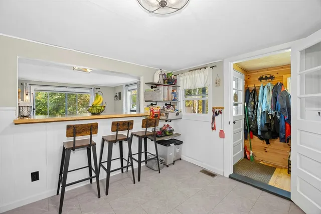 a view of a livingroom with furniture and a window