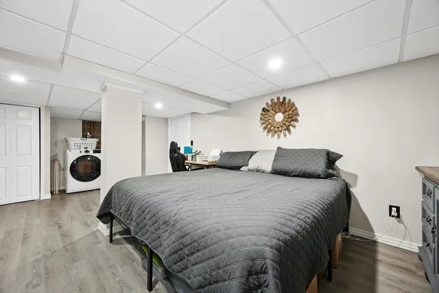 a spacious bedroom with a bed and cabinets