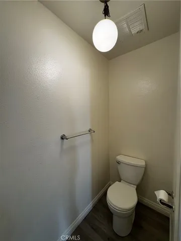 a front view of a bathroom with a window