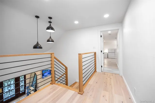 wooden floor in an empty room with a fireplace and wooden floor
