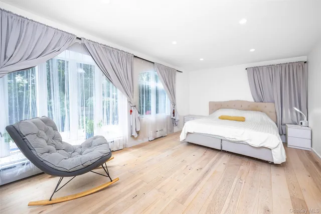 a living room with a couch and ceiling fan