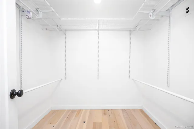 a spacious bedroom with a bed and a couch