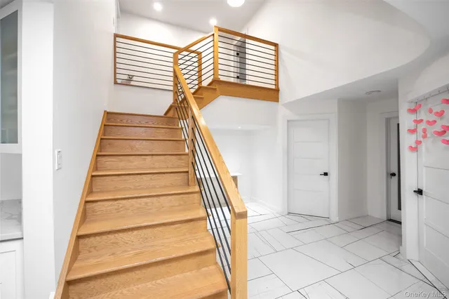 a spacious bedroom with a bed and a large window