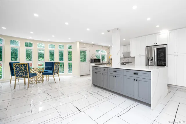 a utility room with sink dryer and washer