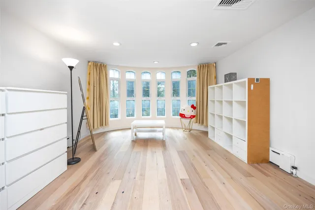 a spacious bathroom with a bathtub and shower
