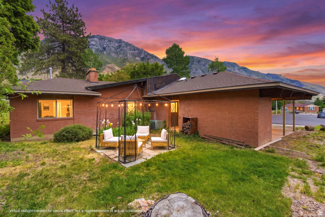 Undisclosed Address Provo, UT 84604 - Photo 1 of 1 Expansive backyard featuring a stone patio with a metal gazebo and string lighting