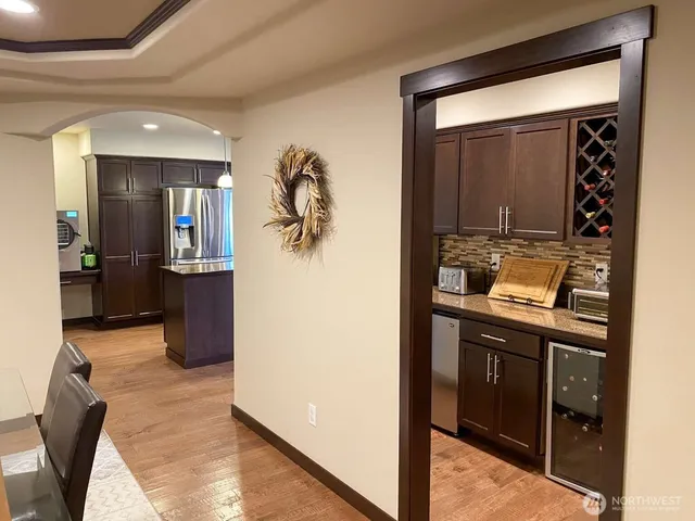 a view of kitchen and dining room with windows