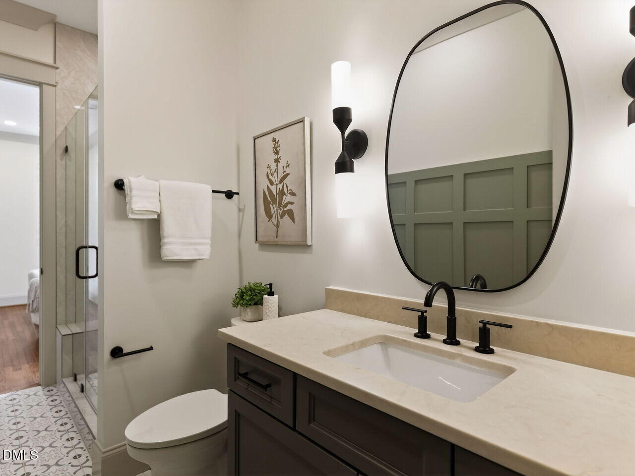504 Tilden Street Raleigh, NC 27605 - Photo 21 of 58 a bathroom with a toilet a sink and mirror