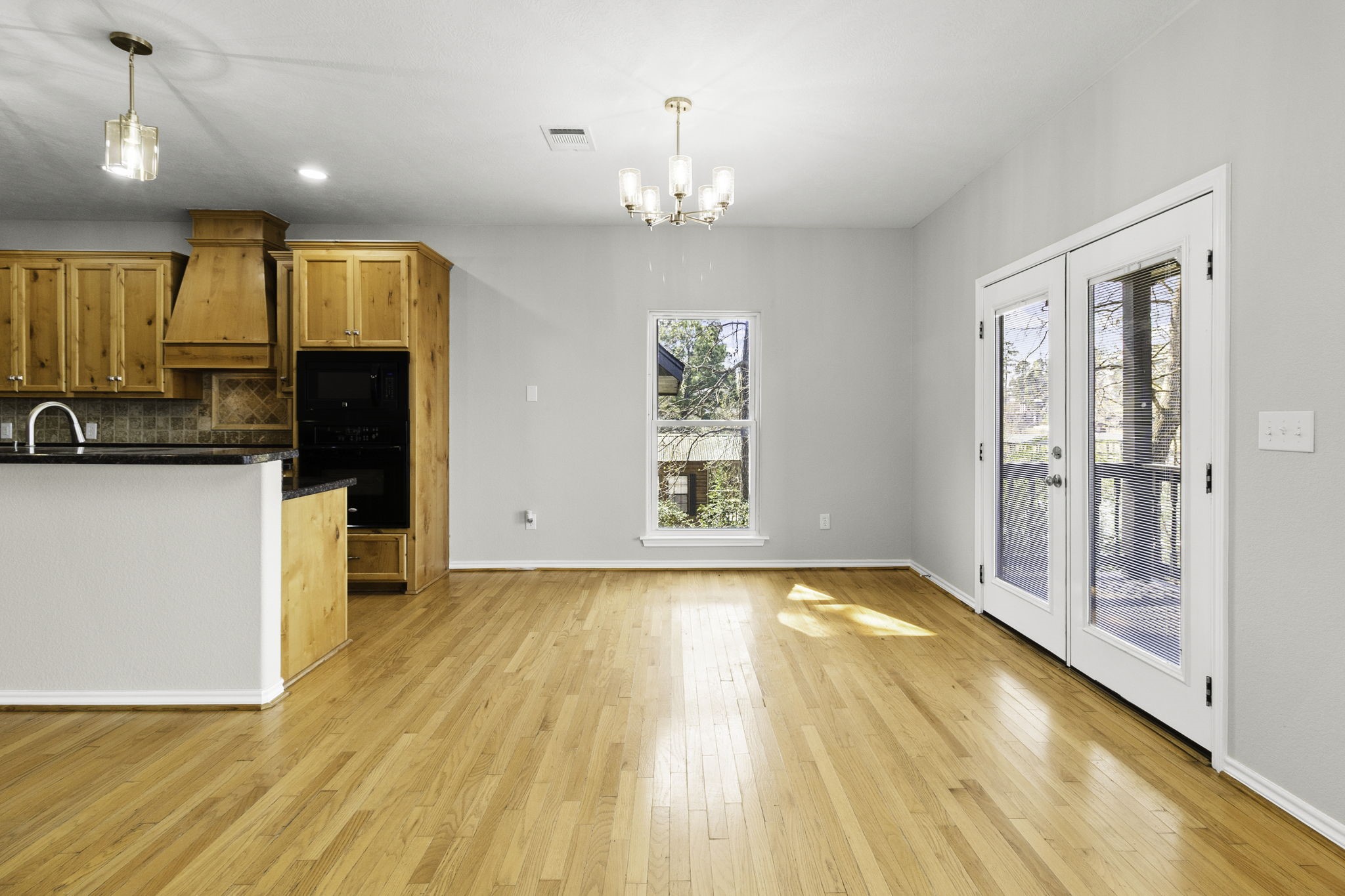 231 North Point Road Trinity, TX 75862 - Photo 18 of 50 a view of a kitchen with kitchen island wooden floor and window