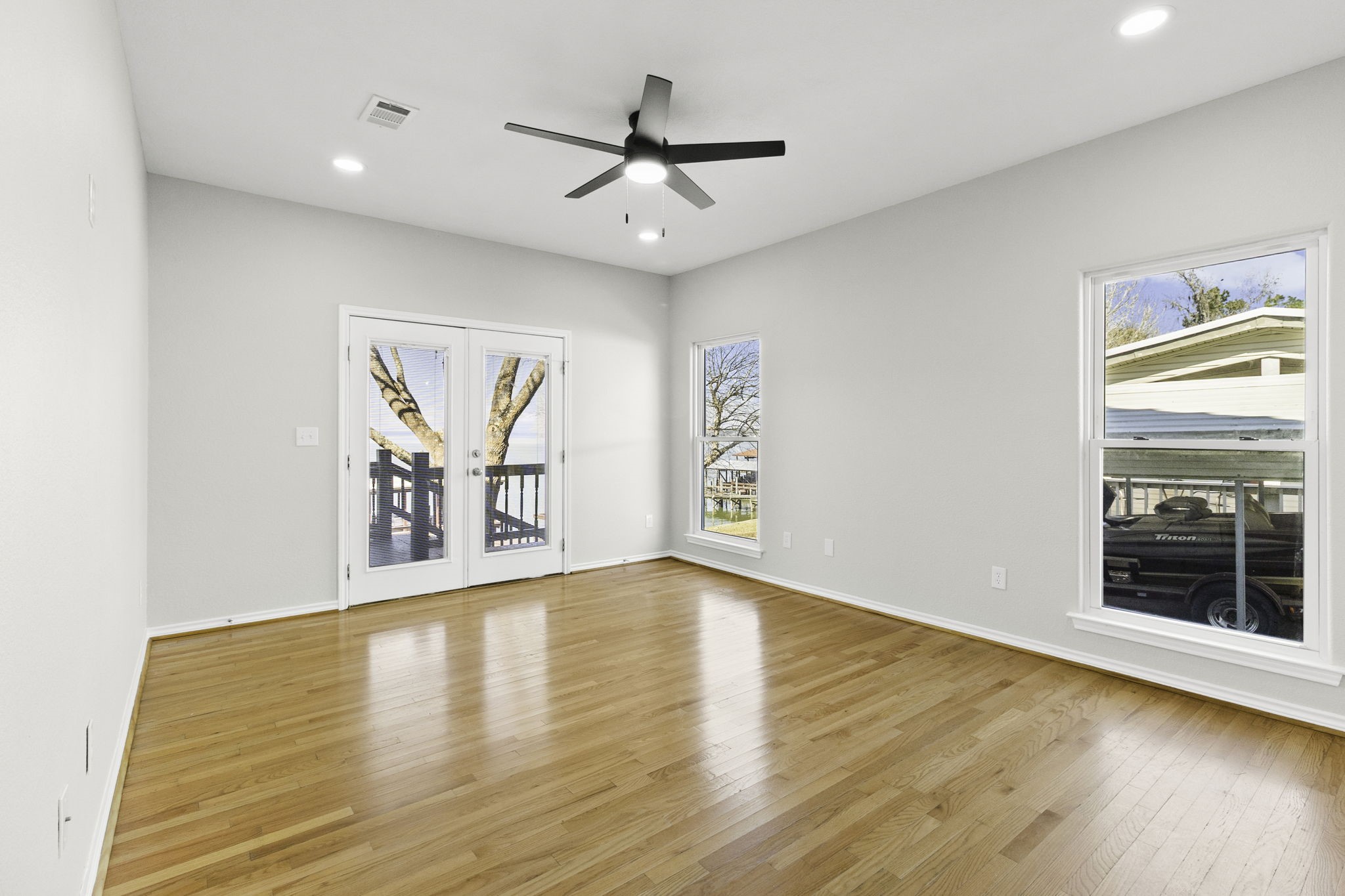 231 North Point Road Trinity, TX 75862 - Photo 25 of 50 wooden floor in an empty room with a window
