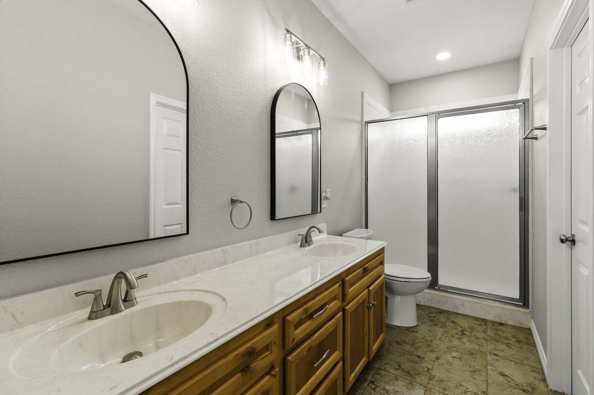 231 North Point Road Trinity, TX 75862 - Photo 30 of 50 a bathroom with a double vanity sink and a mirror