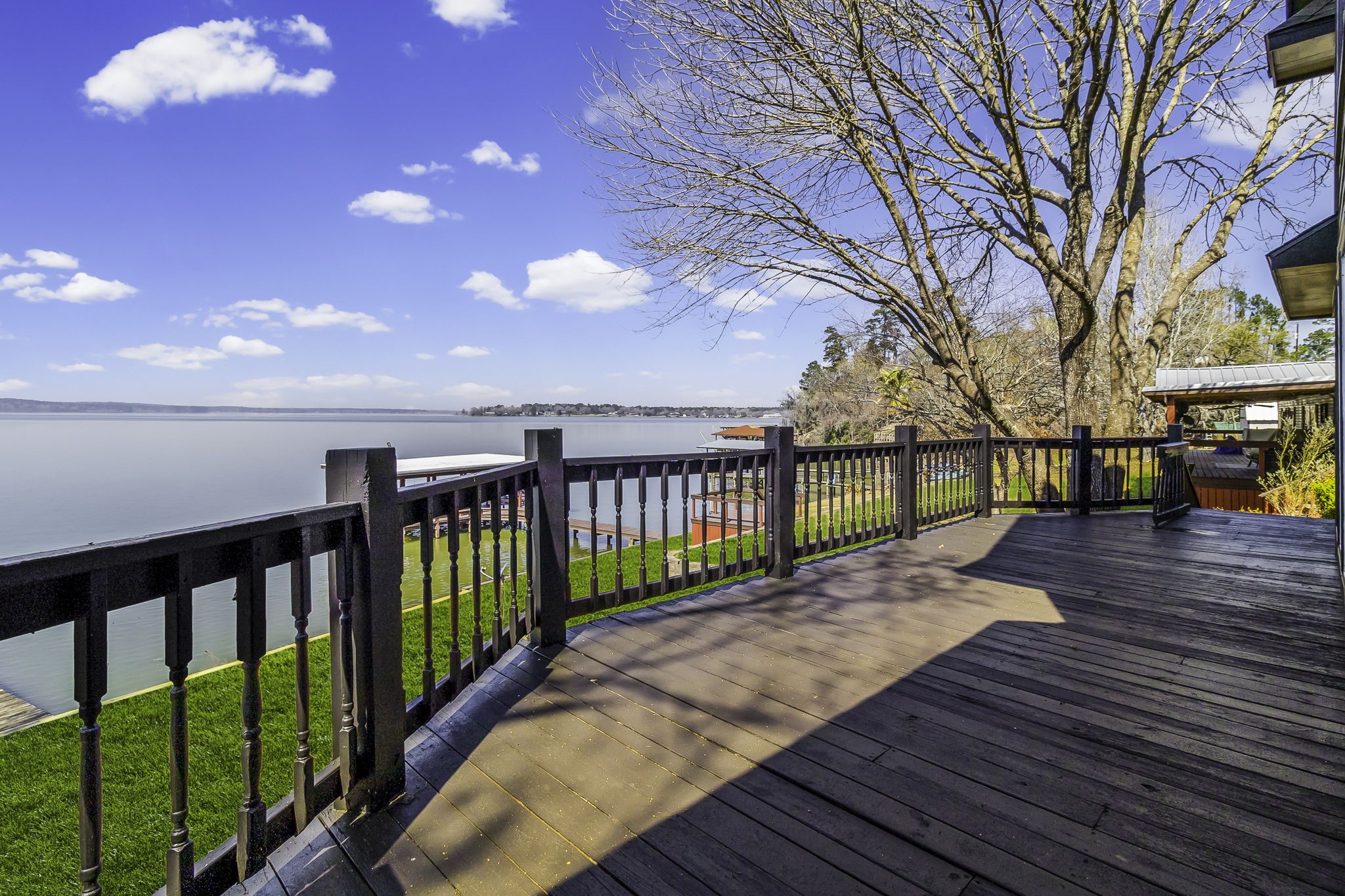 231 North Point Road Trinity, TX 75862 - Photo 44 of 50 a view of a deck with large trees and wooden fence