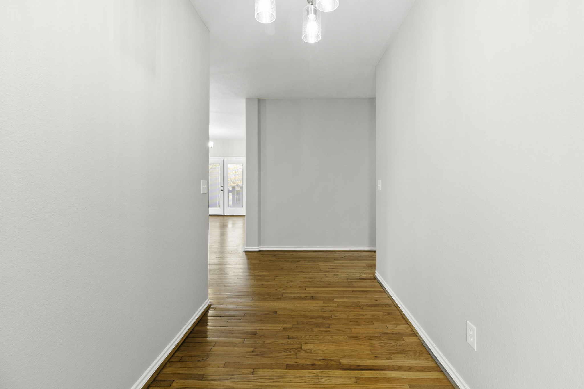 231 North Point Road Trinity, TX 75862 - Photo 9 of 50 a view of a hallway with wooden floor