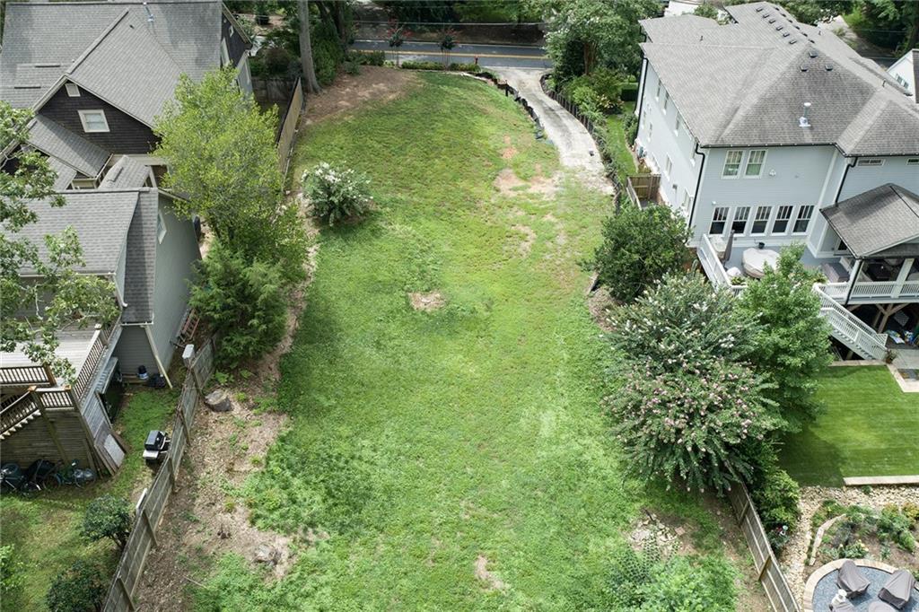 348 East Wesley Road Northeast Atlanta, GA 30305 - Photo 1 of 1 an aerial view of residential houses with outdoor space and trees