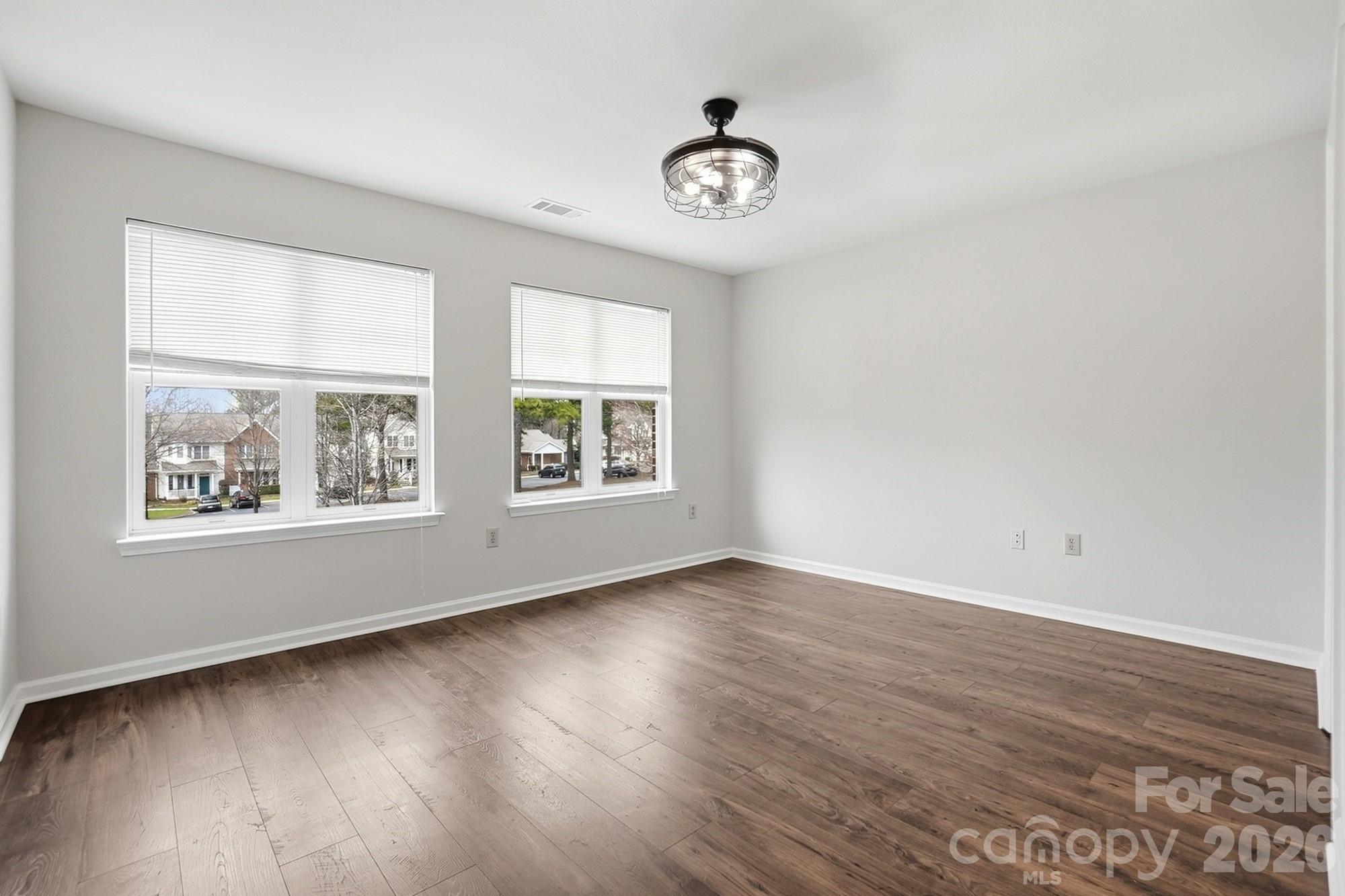 711 Stone Village Drive Fort Mill, SC 29708 - Photo 29 of 46 a view of an empty room with wooden floor and a window