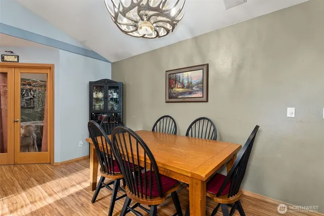 a dining room with furniture and window