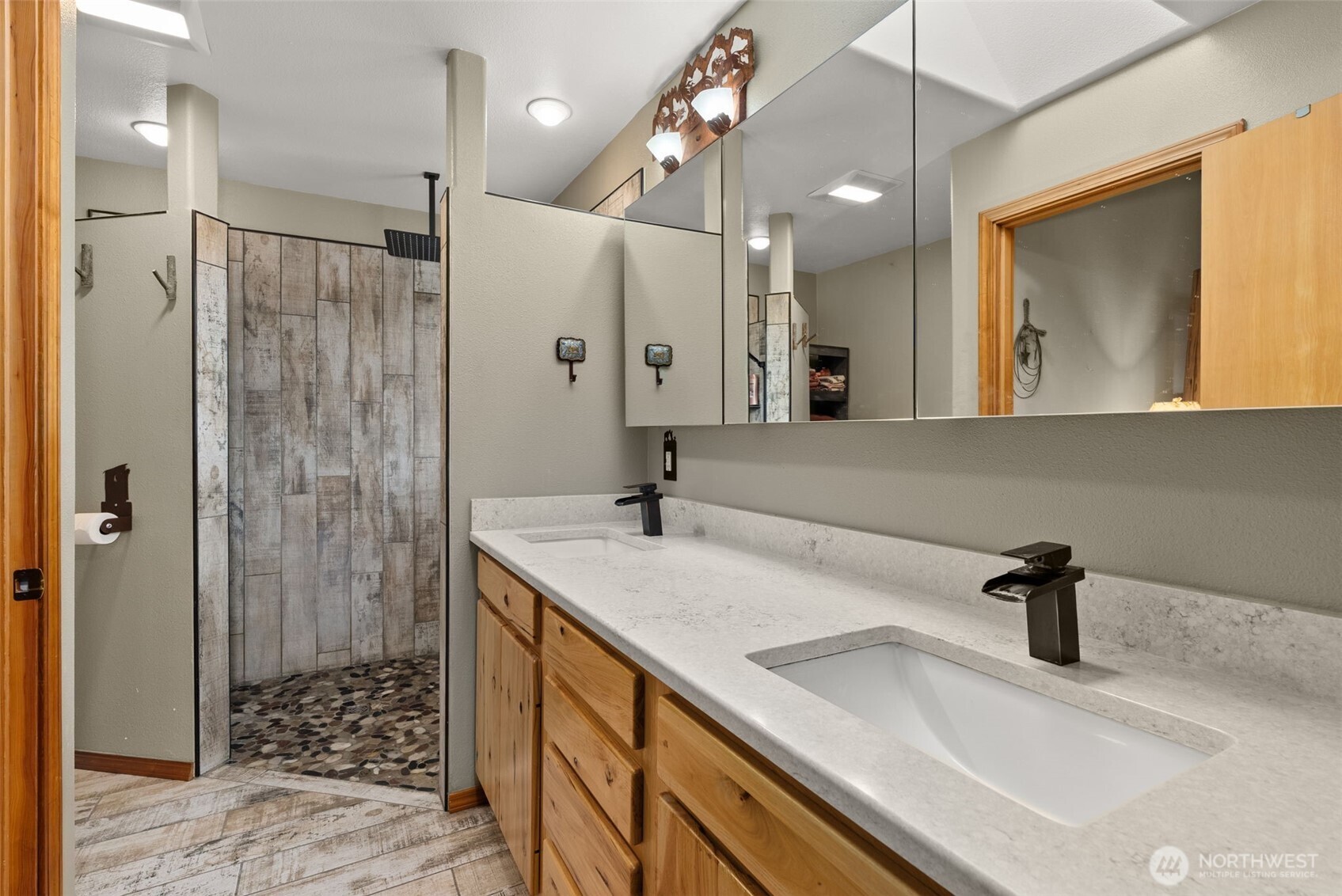 207 Ramsaur Road Centralia, WA 98531 - Photo 16 of 40 a bathroom with a sink a toilet a large mirror and shower