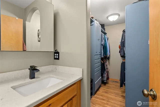 a bathroom with a sink and a mirror