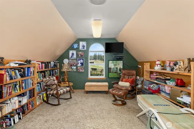 a room with furniture toys and a book shelf