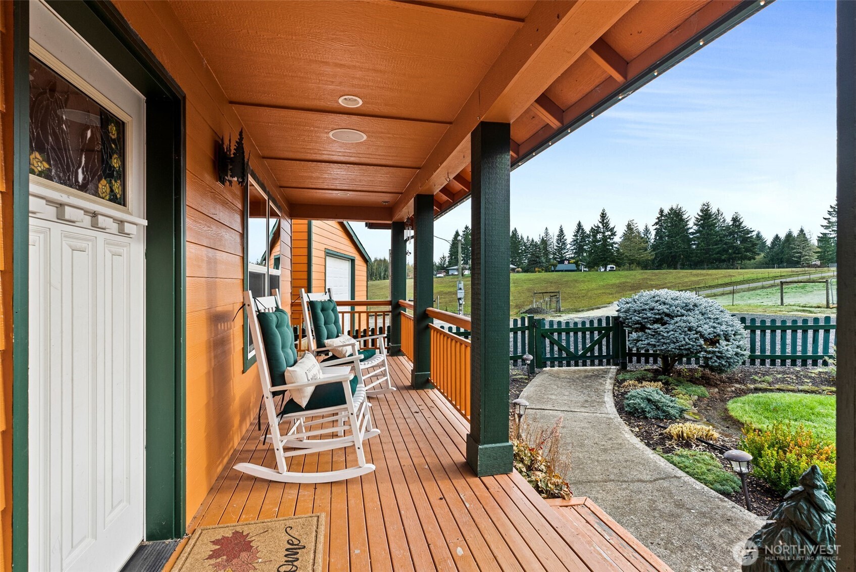 207 Ramsaur Road Centralia, WA 98531 - Photo 4 of 40 a view of a balcony with couch and wooden floor