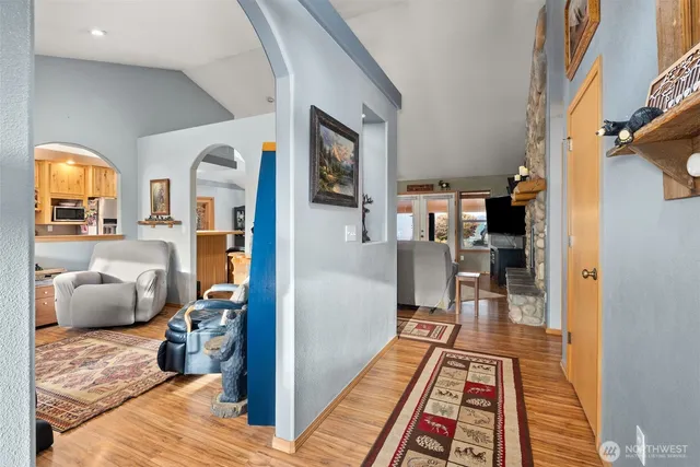 a room with lots of furniture and a rug