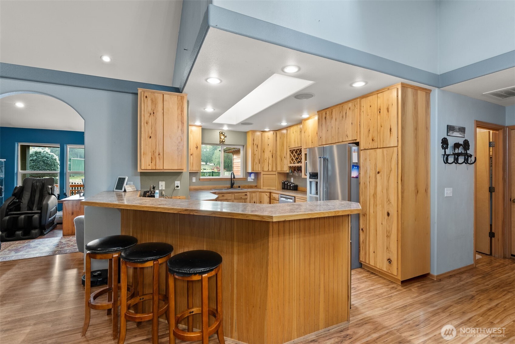 207 Ramsaur Road Centralia, WA 98531 - Photo 10 of 40 a kitchen with stainless steel appliances a sink and a refrigerator