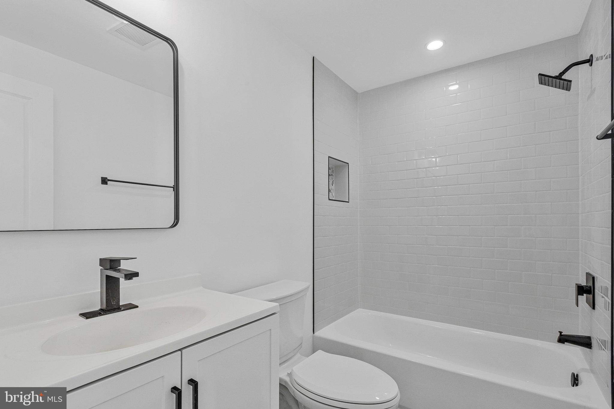 3365 Arundel On The Bay Road Annapolis, MD 21403 - Photo 20 of 48 a bathroom with a sink toilet and shower