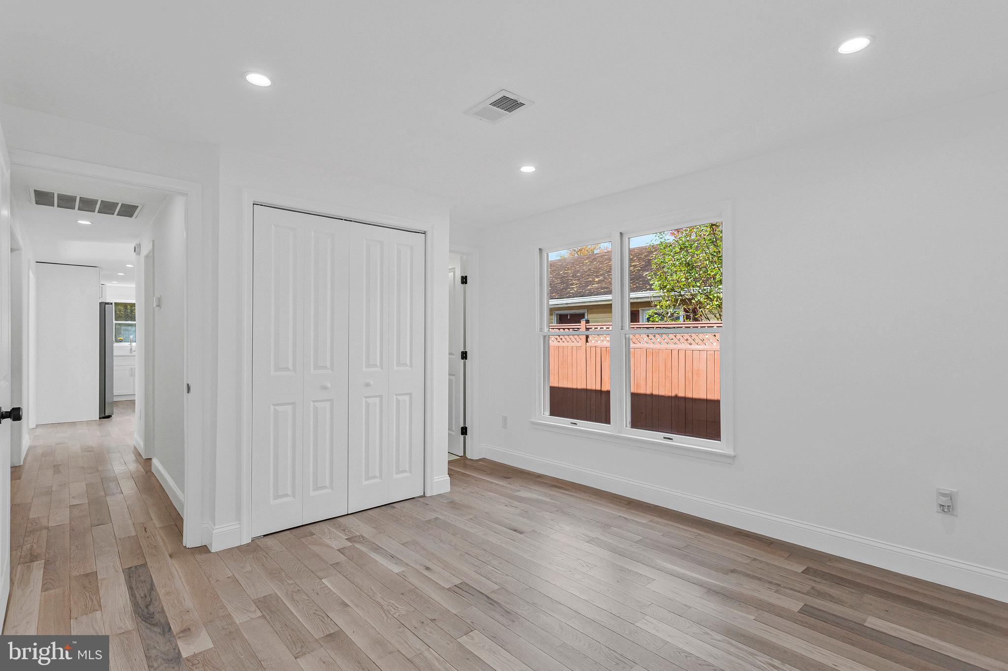 3365 Arundel On The Bay Road Annapolis, MD 21403 - Photo 28 of 48 wooden floor in an empty room with a window