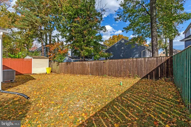 a view of outdoor space with wooden fence