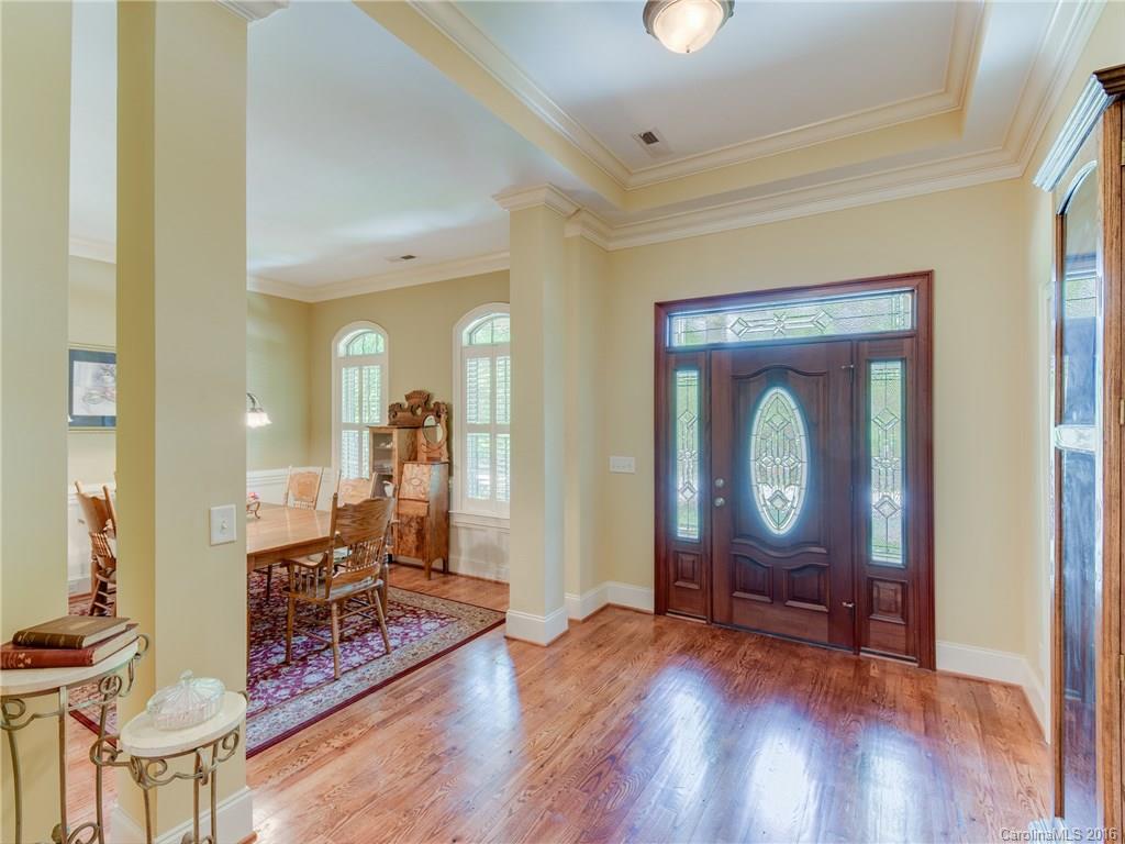 6706 Fox Ridge Circle Davidson, NC 28036 - Photo 2 of 24 a view of a livingroom with wooden floor and a chandelier