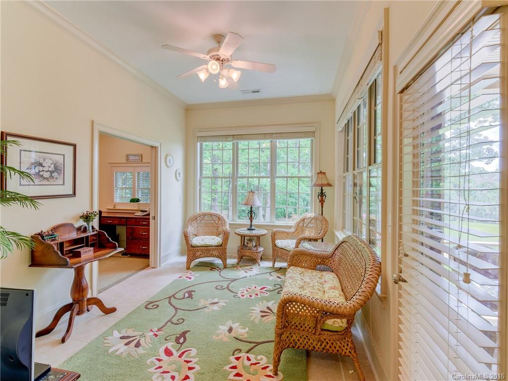6706 Fox Ridge Circle Davidson, NC 28036 - Photo 16 of 24 a living room with furniture and floor to ceiling windows