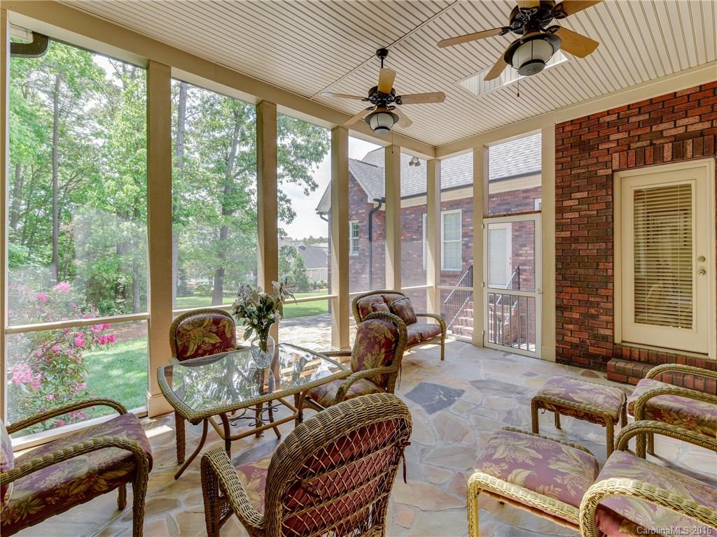 6706 Fox Ridge Circle Davidson, NC 28036 - Photo 18 of 24 a living room with furniture and a floor to ceiling windows