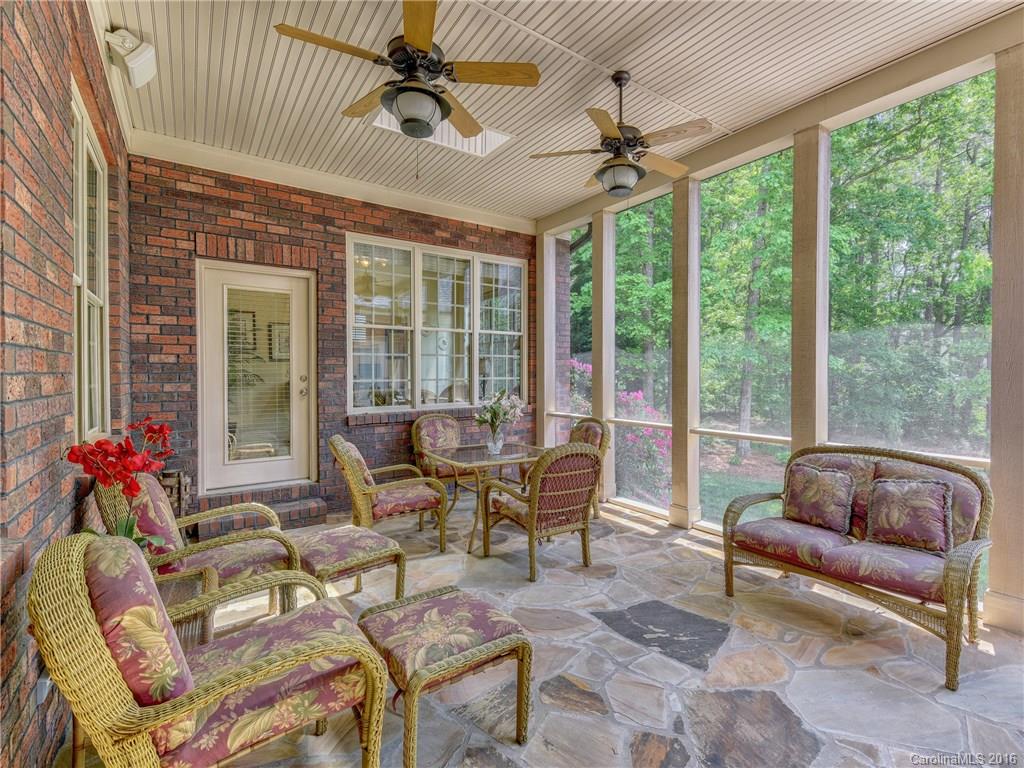 6706 Fox Ridge Circle Davidson, NC 28036 - Photo 19 of 24 a living room with furniture and floor to ceiling windows