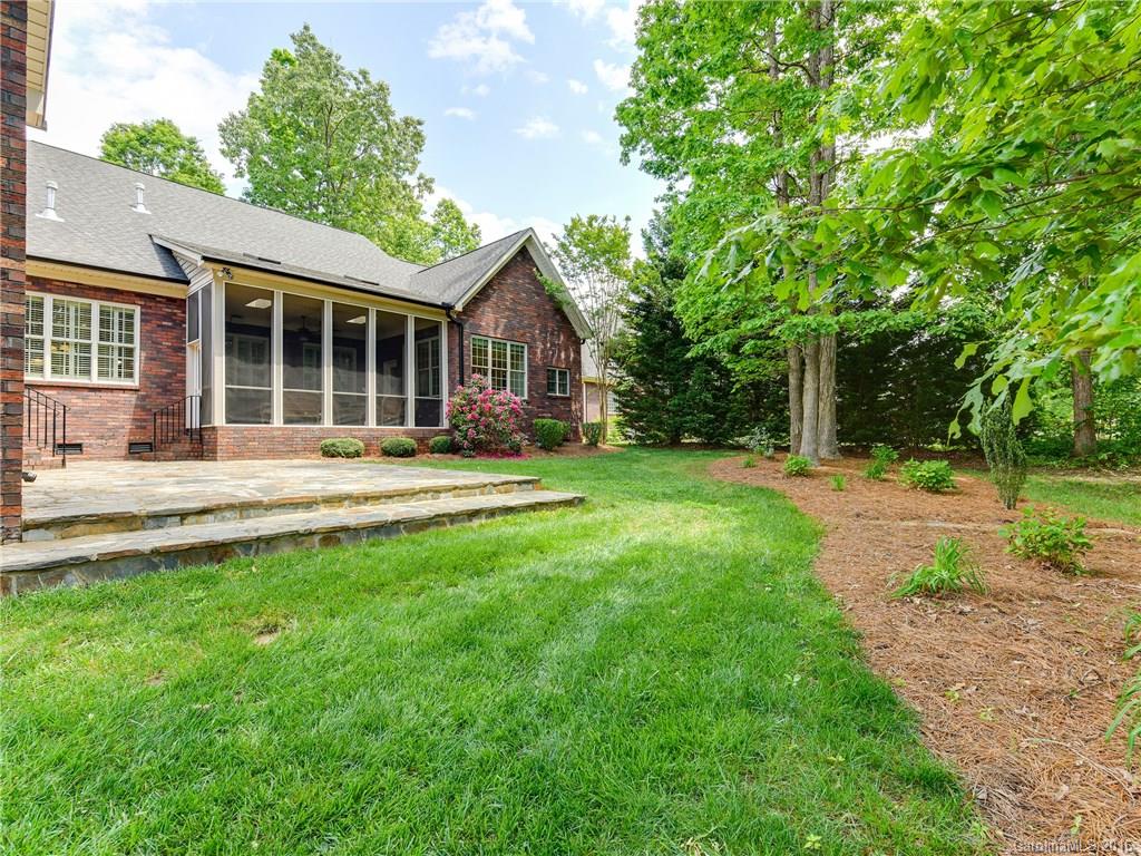 6706 Fox Ridge Circle Davidson, NC 28036 - Photo 21 of 24 a front view of a house with a yard and trees