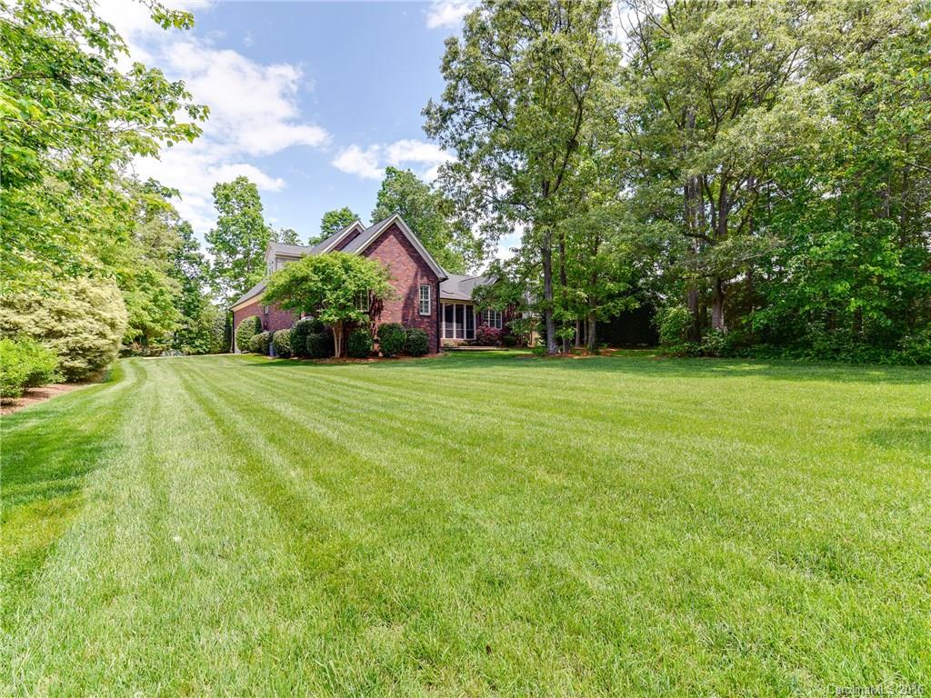 6706 Fox Ridge Circle Davidson, NC 28036 - Photo 23 of 24 a view of a trees in front of a house with a yard