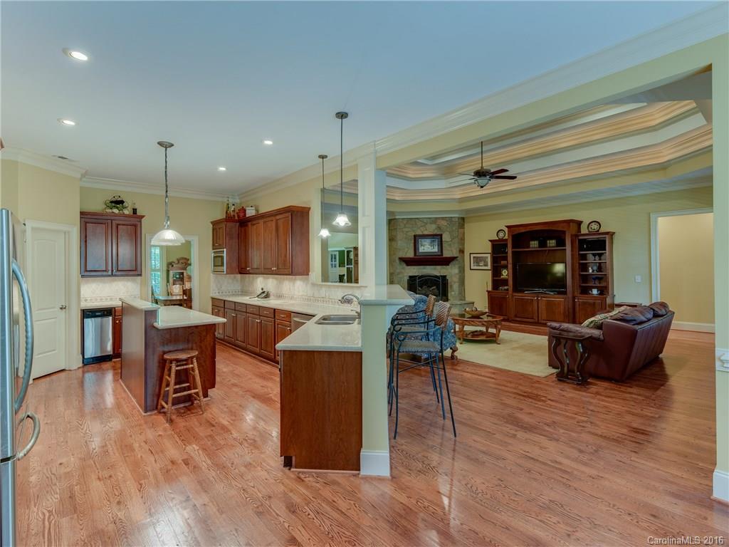 6706 Fox Ridge Circle Davidson, NC 28036 - Photo 6 of 24 a living room with furniture kitchen view and a wooden floor