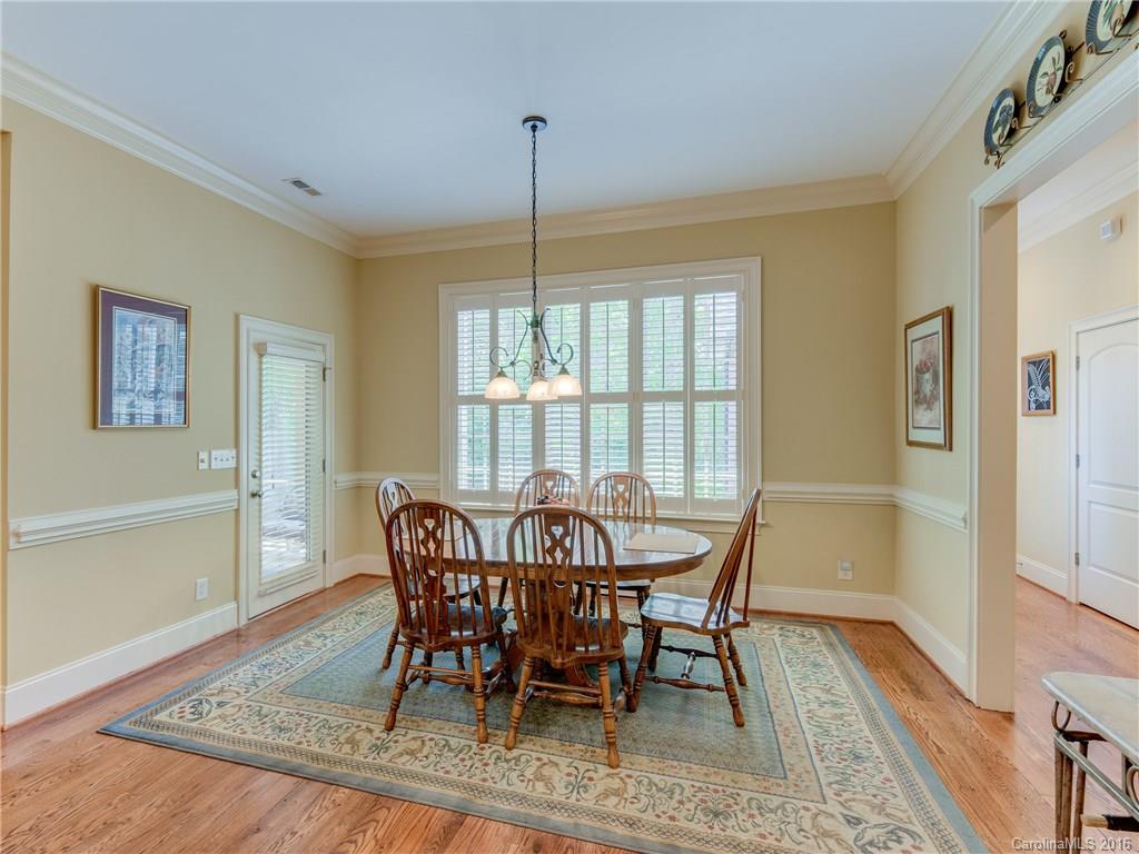 6706 Fox Ridge Circle Davidson, NC 28036 - Photo 9 of 24 a view of a dining room with furniture window and wooden floor