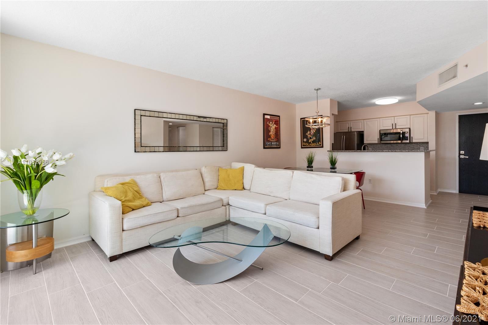 90 Alton Road, Unit 608 Miami Beach, FL 33139 - Photo 6 of 21 a living room with furniture and a couch