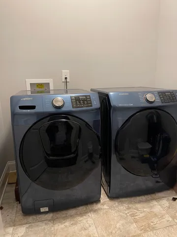 a utility room with washing machine