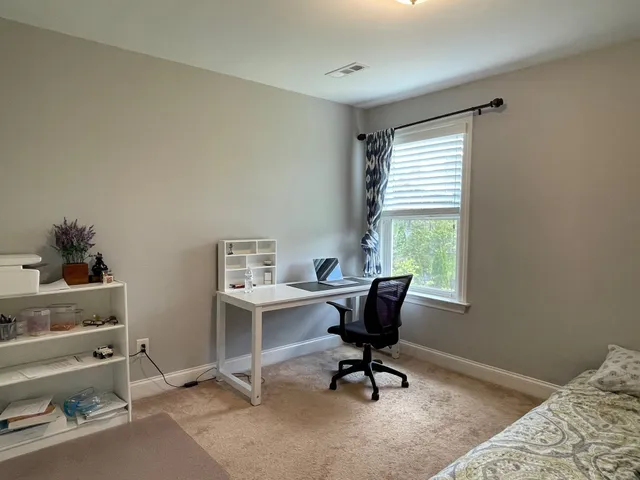 a workspace with furniture and a window