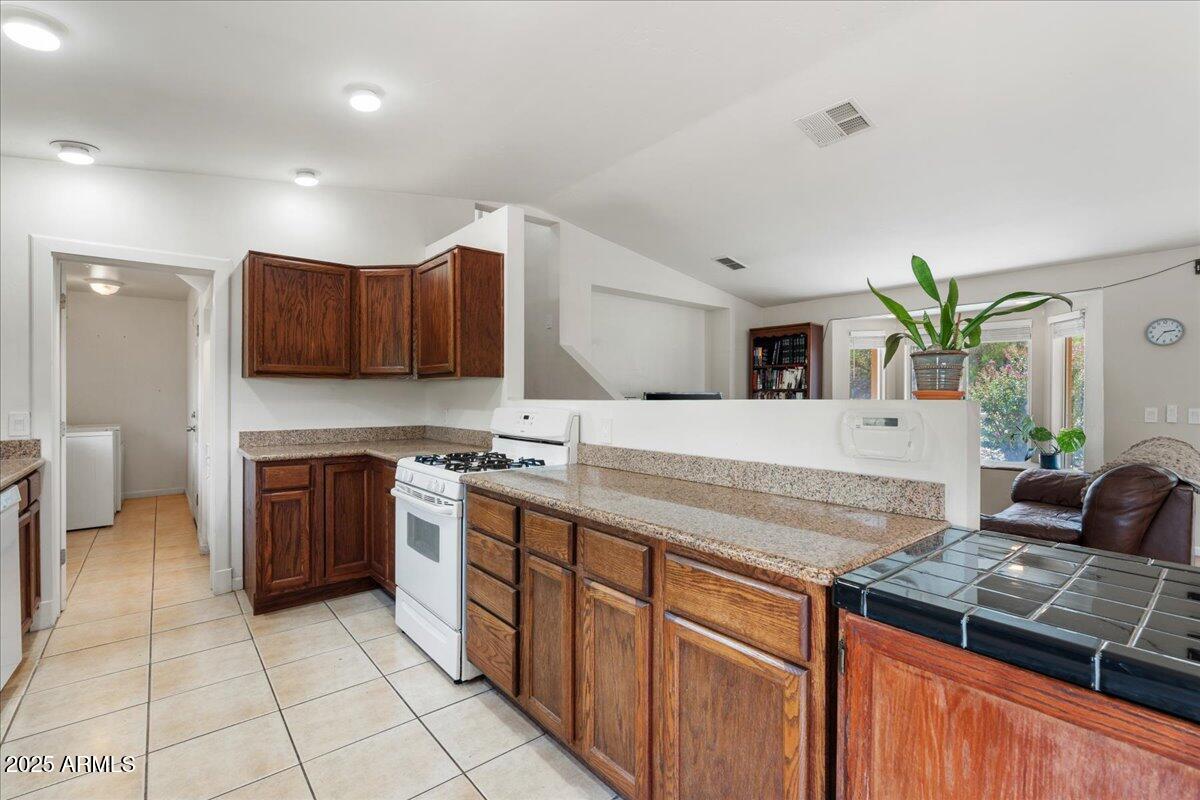 2527 Rio Verde Drive Cottonwood, AZ 86326 - Photo 11 of 43 a kitchen with stainless steel appliances granite countertop a stove and a sink
