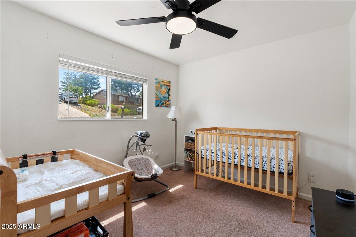 2527 Rio Verde Drive Cottonwood, AZ 86326 - Photo 17 of 43 a bedroom with a bed and window