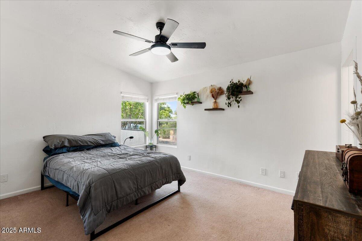 2527 Rio Verde Drive Cottonwood, AZ 86326 - Photo 18 of 43 a bedroom with a bed and a window