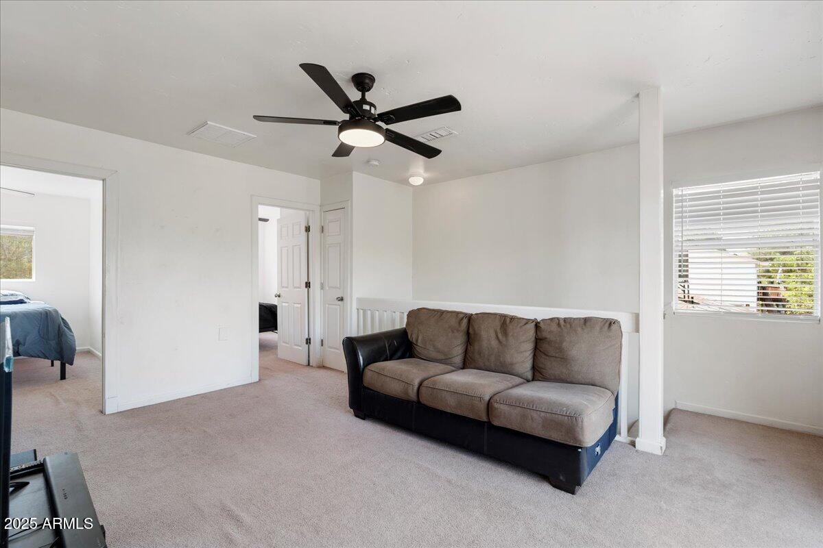 2527 Rio Verde Drive Cottonwood, AZ 86326 - Photo 21 of 43 a living room with furniture and a window