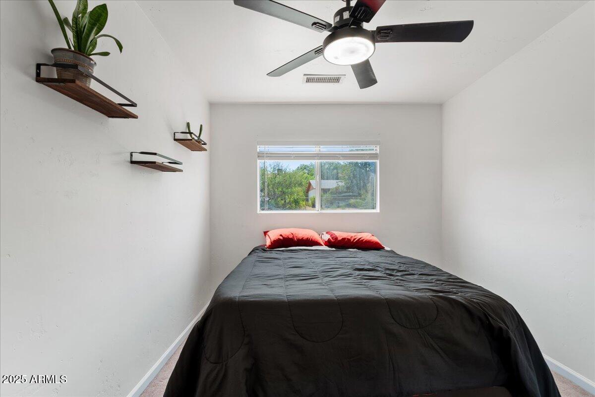 2527 Rio Verde Drive Cottonwood, AZ 86326 - Photo 25 of 43 a bedroom with a bed and a window
